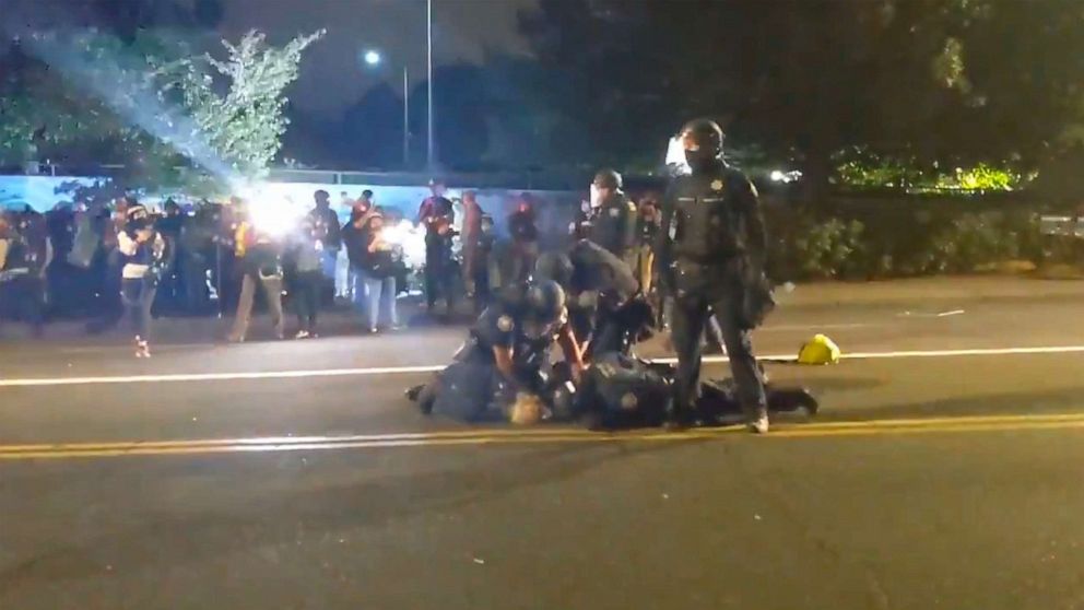 Violence at work Video surfaces of police punching protester as governor debuts plan to end violence in Portland